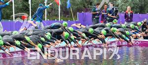 Athletes dive into the water at the start of the 2012 London Olympics Women's Triathlon