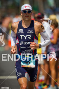 Andy Potts runs down Ali'i Drive past mile one at the Ironman World Championship in Kailua-Kona, Hawaii on October 13, 2012