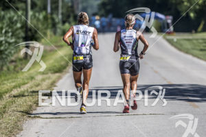 Nina Kraft and Ashley Clifford running together at the 2013 Ironman Muncie 70.3 on July 13, 2013 in Muncie, Indiana