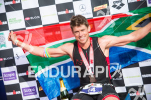 Matt Trautman enjoys his win at the 2014 Ironman Wales in Tenby, Pembrokeshire, Wales, United Kingdom on September 14, 2014.